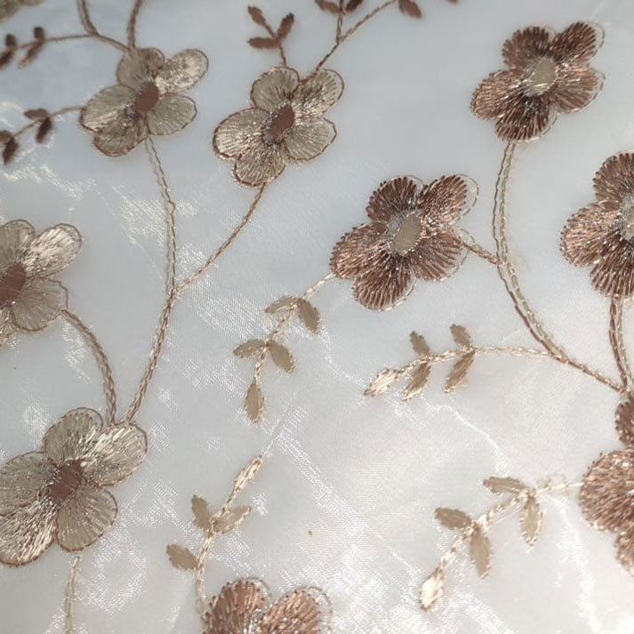 Delicate Blossoms on Sheer Fabric: Golden Floral Embroidery Pattern