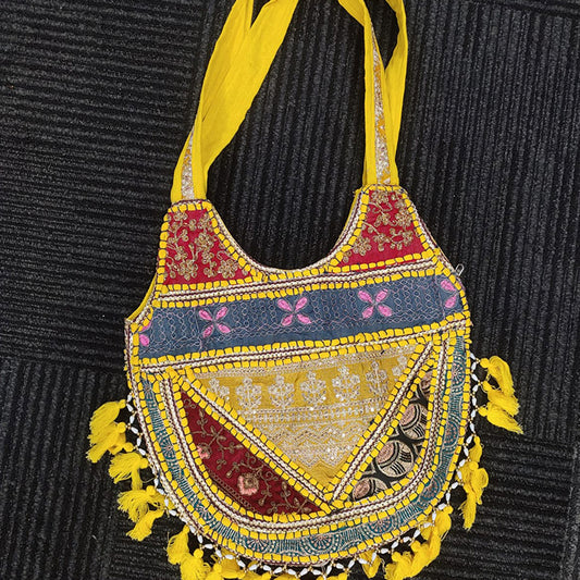 Decorative handbag with colorful patterns and yellow accents